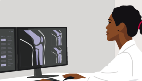 A graphic illustration of a person in a lab coat sitting at a desk and looking at knee joint X-rays on two computer monitors. The person, with dark hair pulled back by a pink band, interacts with the computer using a mouse.